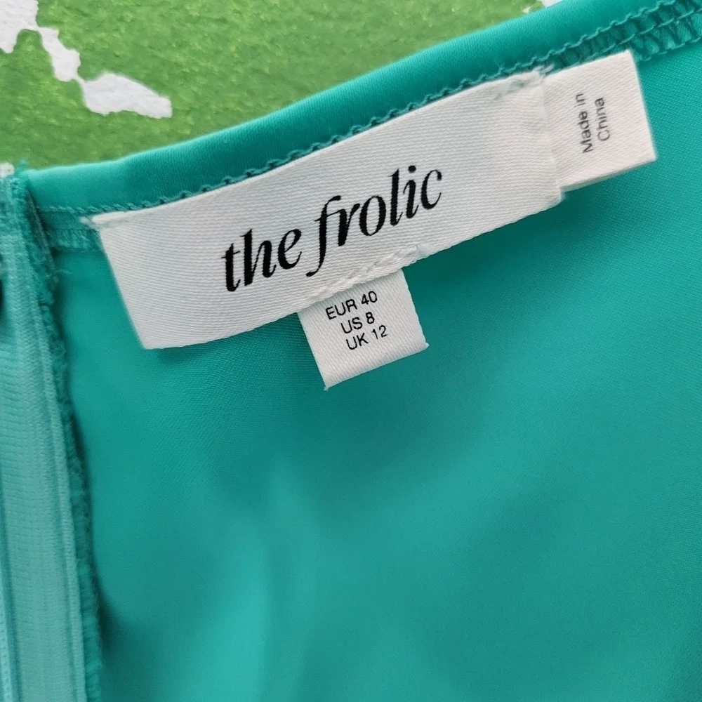 The Frolic Twist Front Satin Shift Mini Dress.